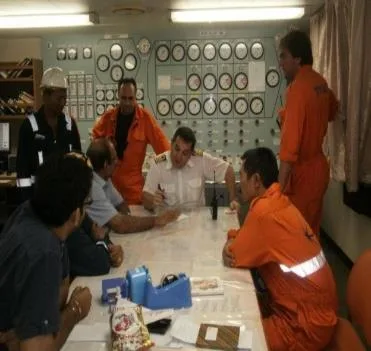 Crew briefing in the engine control room